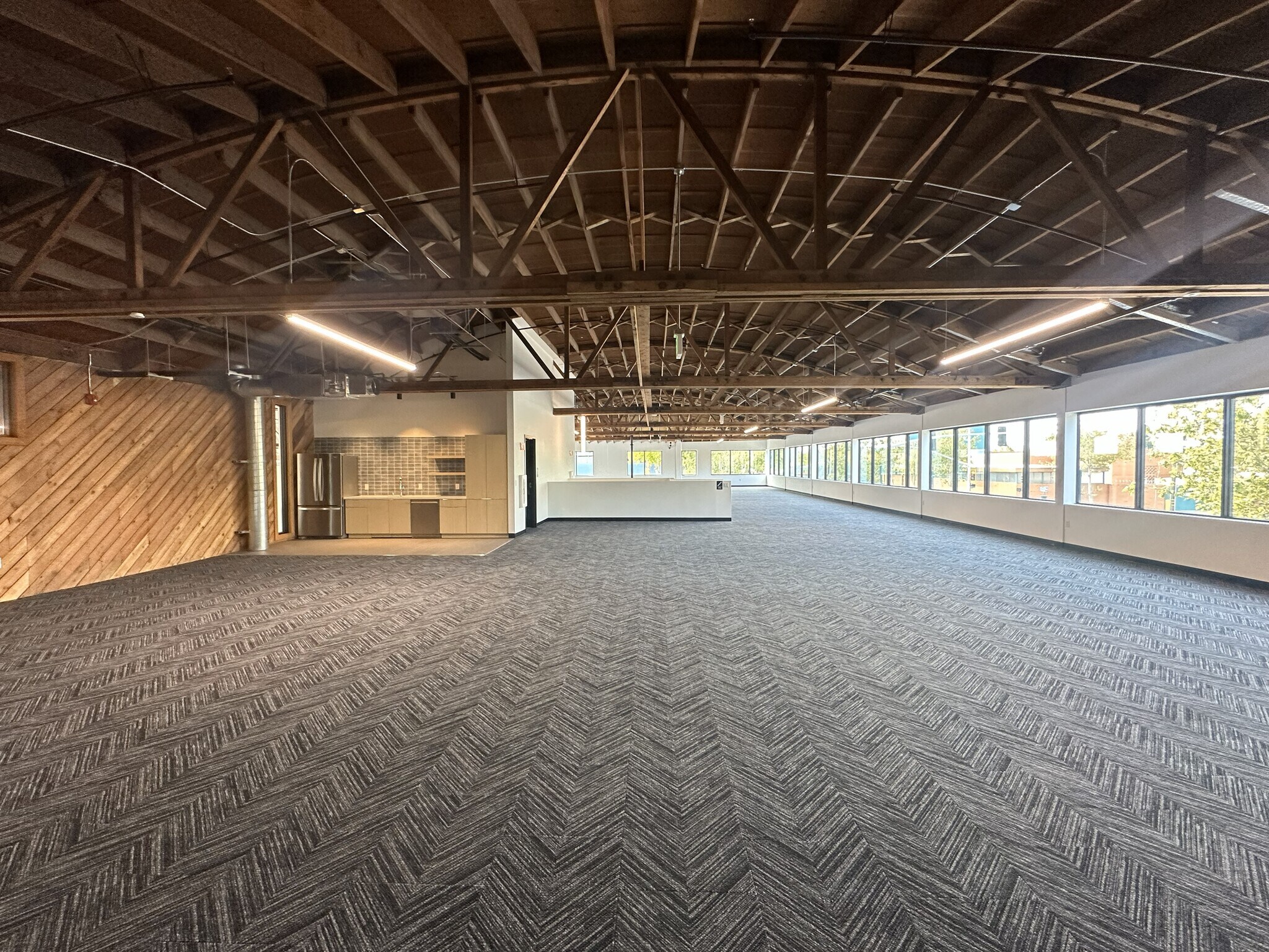 Renovated office with exposed trusses and natural light